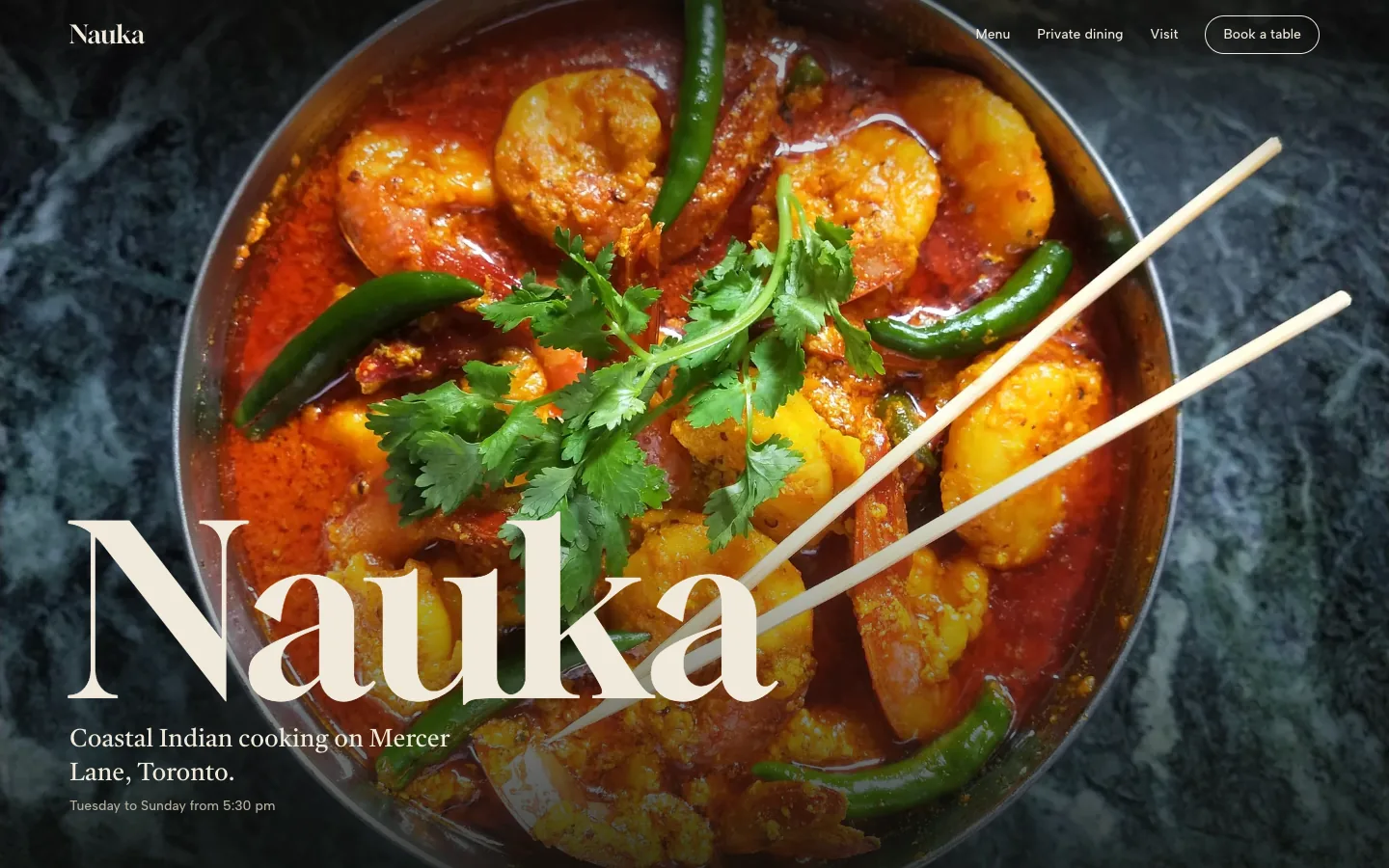 The Nauka concept home page: a prawn curry filling the screen under the name.