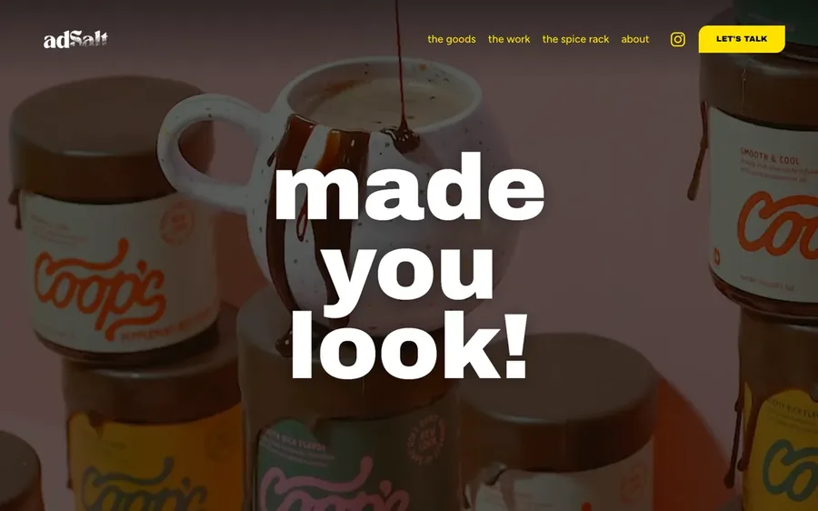 The adSalt home page: bold white type over a film of a sauce being poured into a mug.