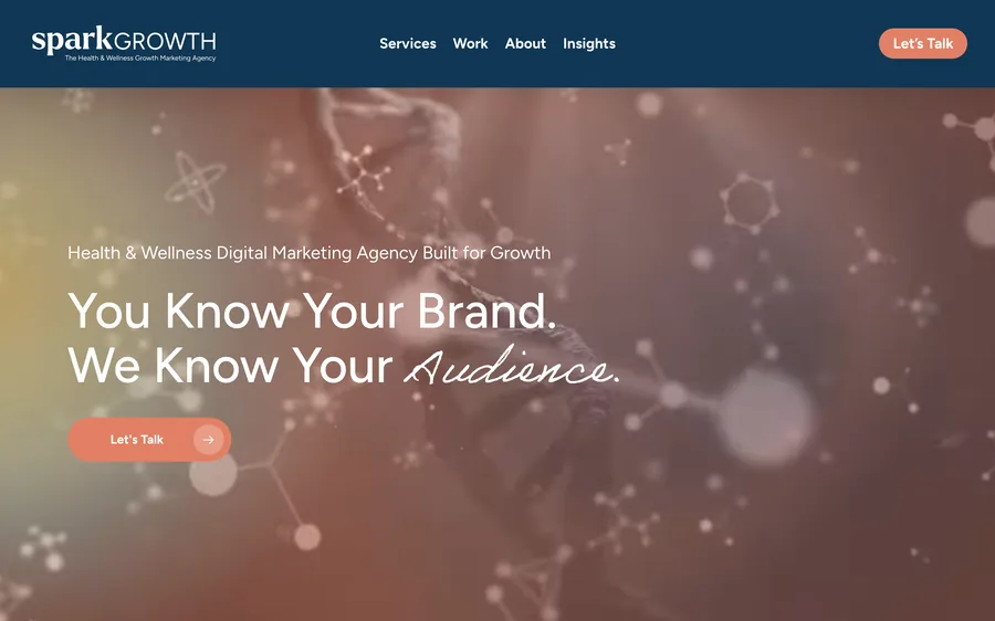 The Spark Growth home page: a navy header over a soft photo of molecules, with the line You Know Your Brand. We Know Your Audience.